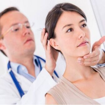 Neurologist examining patient with neck pain